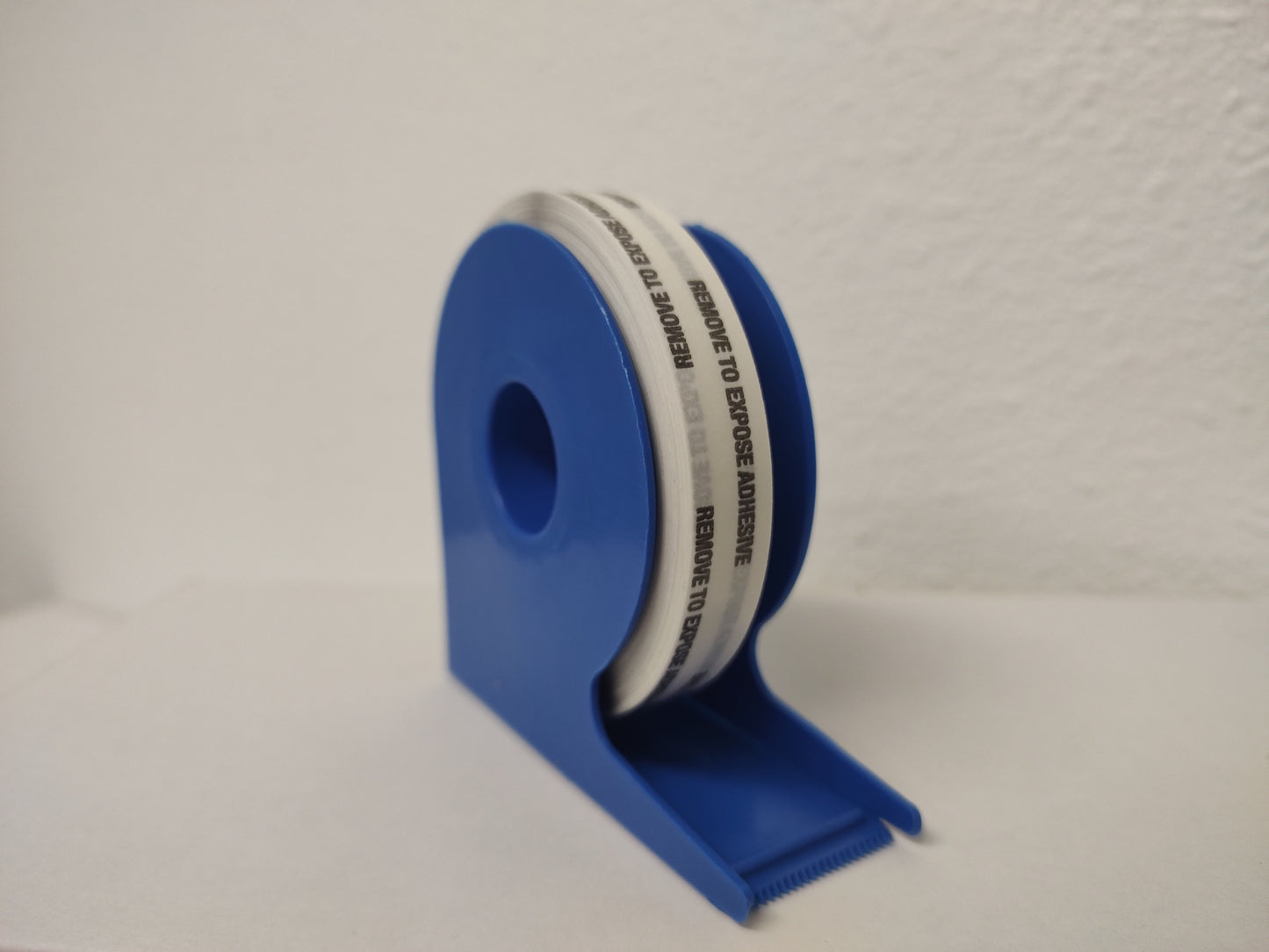 Heavy Duty Double Coated tissue tape w/Extended liner on a dispenser pack